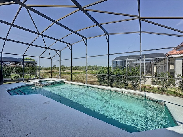 219 Rosso Dr, Davenport, FL 33837 - view of swimming pool with a pool with connected hot tub, glass enclosure, and a patio