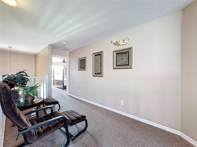 219 Rosso Dr, Davenport, FL 33837 - corridor featuring carpet, baseboards, and a textured ceiling