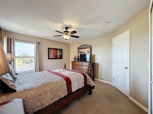 219 Rosso Dr, Davenport, FL 33837 - carpeted bedroom featuring ceiling fan, baseboards, and a textured ceiling