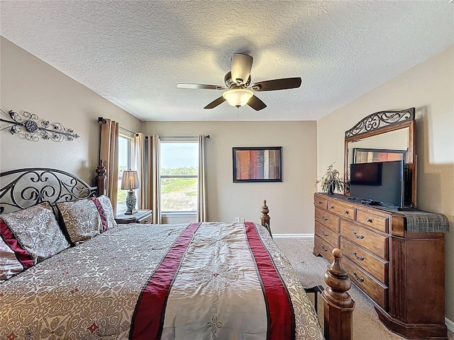 219 Rosso Dr, Davenport, FL 33837 - bedroom with carpet floors, a ceiling fan, a textured ceiling, and baseboards