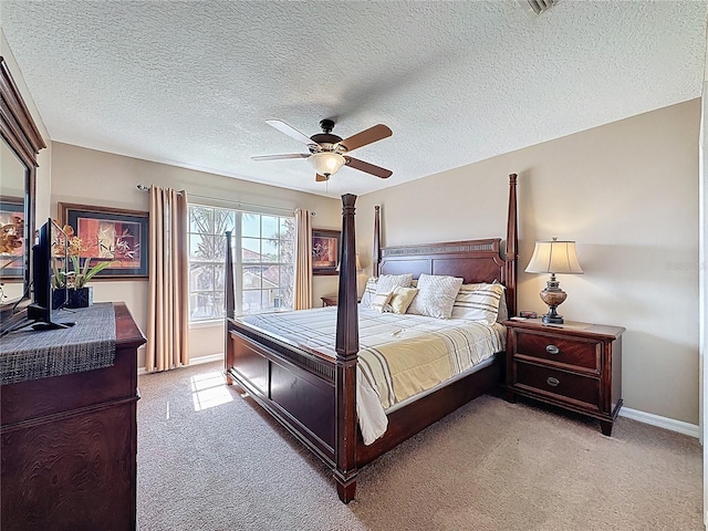 219 Rosso Dr, Davenport, FL 33837 - bedroom featuring light carpet, baseboards, a textured ceiling, and ceiling fan
