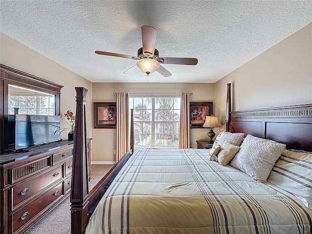 219 Rosso Dr, Davenport, FL 33837 - carpeted bedroom featuring a textured ceiling, multiple windows, and a ceiling fan