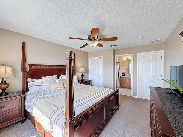 219 Rosso Dr, Davenport, FL 33837 - bedroom featuring carpet, a textured ceiling, a ceiling fan, and ensuite bathroom