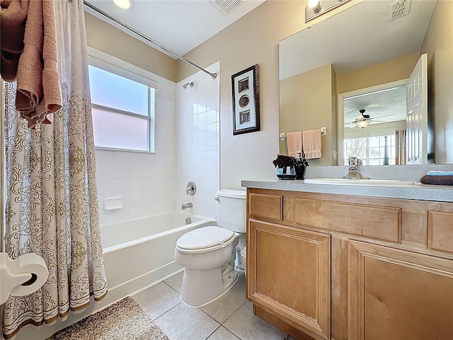 219 Rosso Dr, Davenport, FL 33837 - full bath featuring plenty of natural light, toilet, shower / bath combo, and tile patterned floors