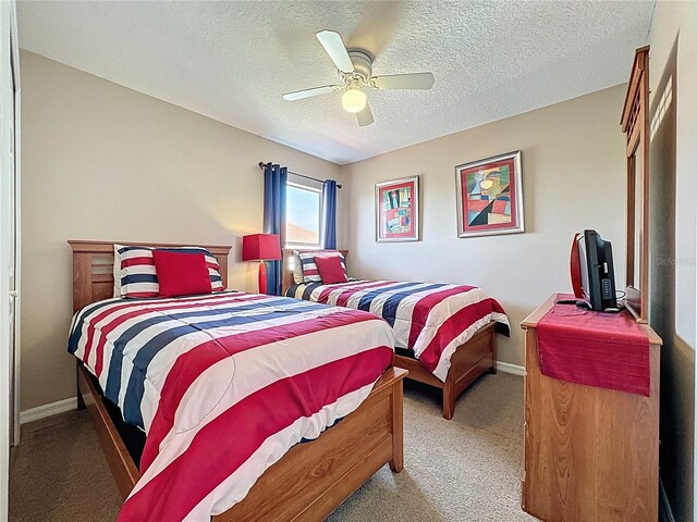 219 Rosso Dr, Davenport, FL 33837 - carpeted bedroom featuring a textured ceiling, baseboards, and a ceiling fan