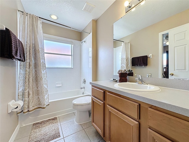 219 Rosso Dr, Davenport, FL 33837 - bathroom with tile patterned floors, shower / bath combo with shower curtain, toilet, and vanity
