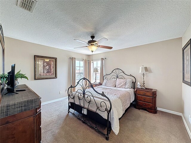 219 Rosso Dr, Davenport, FL 33837 - carpeted bedroom featuring baseboards, a ceiling fan, and a textured ceiling