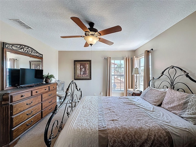 219 Rosso Dr, Davenport, FL 33837 - bedroom featuring a textured ceiling, carpet floors, and a ceiling fan