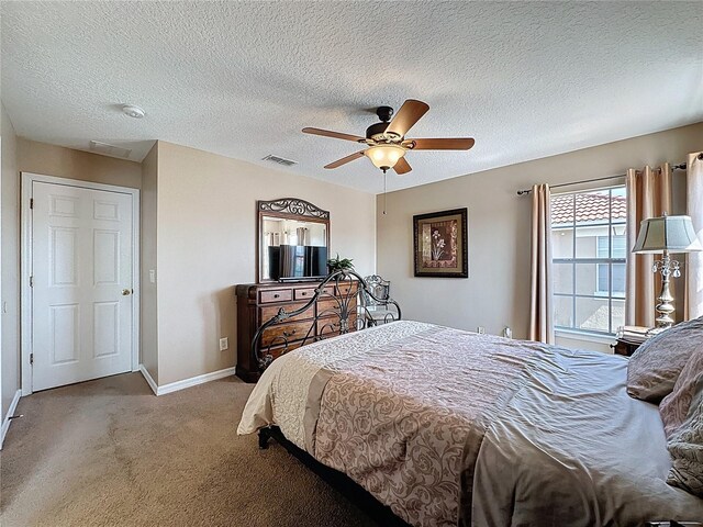 219 Rosso Dr, Davenport, FL 33837 - bedroom with carpet floors, baseboards, a textured ceiling, and ceiling fan