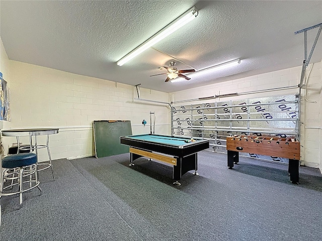 219 Rosso Dr, Davenport, FL 33837 - recreation room featuring a textured ceiling, concrete block wall, billiards, and ceiling fan