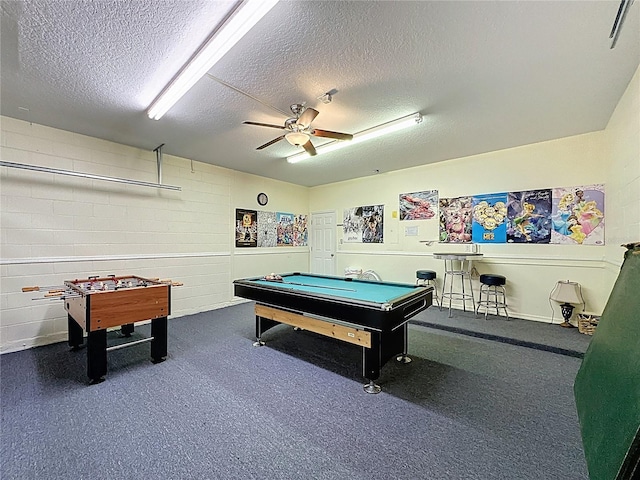 219 Rosso Dr, Davenport, FL 33837 - recreation room featuring a textured ceiling, a ceiling fan, pool table, and concrete block wall