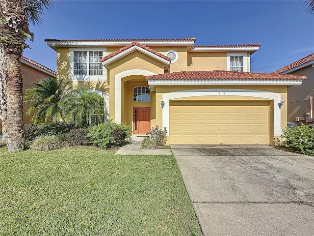 219 Rosso Dr, Davenport, FL 33837 - mediterranean / spanish-style house featuring stucco siding, driveway, a front lawn, and a tile roof