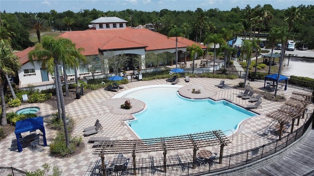 219 Rosso Dr, Davenport, FL 33837 - community pool featuring fence, a patio, and a community hot tub