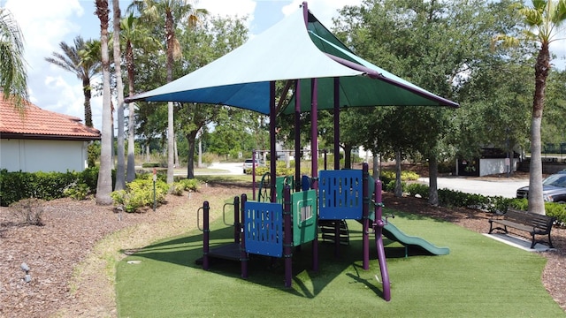 219 Rosso Dr, Davenport, FL 33837 - communal playground featuring a lawn