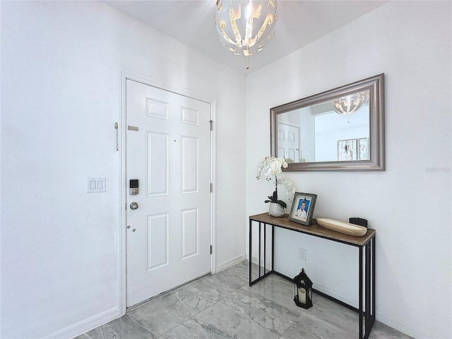 1181 Lone Palm Way, Saint Cloud, FL 34771 - entrance foyer with a chandelier, marble finish floors, and baseboards