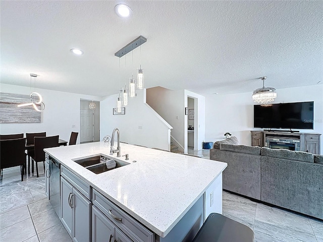 1181 Lone Palm Way, Saint Cloud, FL 34771 - kitchen featuring a sink, dishwashing machine, a chandelier, open floor plan, and gray cabinetry
