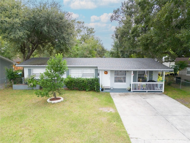 single story home with concrete driveway and covered porch