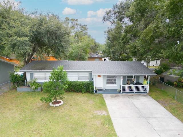 single story home with covered porch, driveway, and roof with shingles
