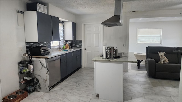 kitchen featuring dishwasher, wall chimney exhaust hood, a sink, light countertops, and backsplash