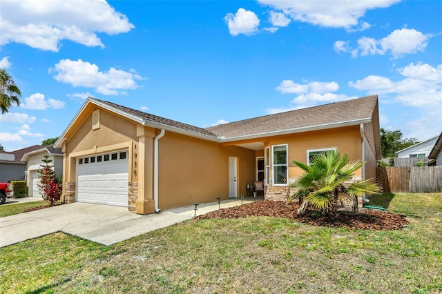 1050 Dees Dr, Oviedo, FL 32765 - ranch-style house featuring stucco siding, a garage, concrete driveway, and stone siding