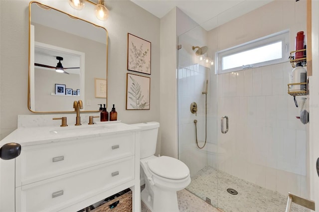 1050 Dees Dr, Oviedo, FL 32765 - full bath with a tile shower, toilet, ceiling fan, and vanity