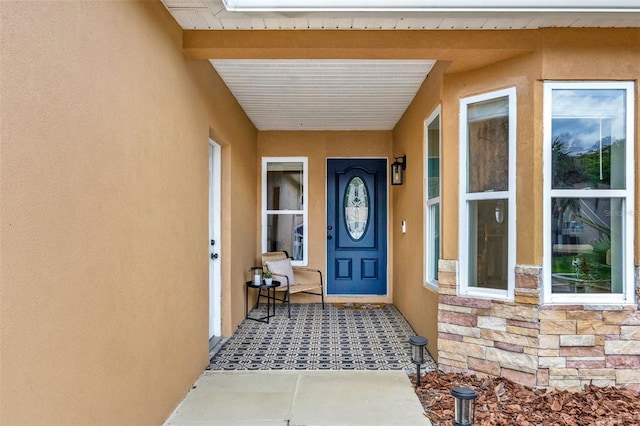 1050 Dees Dr, Oviedo, FL 32765 - property entrance featuring stucco siding and stone siding