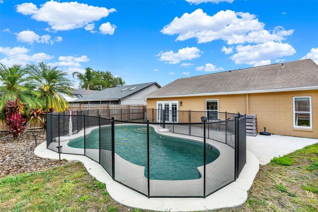 1050 Dees Dr, Oviedo, FL 32765 - view of pool featuring french doors, a fenced backyard, and a patio area
