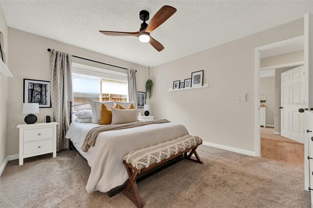 1050 Dees Dr, Oviedo, FL 32765 - bedroom featuring light colored carpet, a textured ceiling, baseboards, and ceiling fan