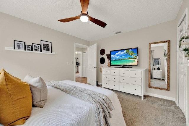 1050 Dees Dr, Oviedo, FL 32765 - bedroom with light colored carpet, a ceiling fan, and baseboards