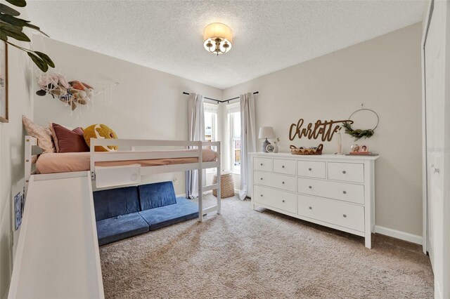 1050 Dees Dr, Oviedo, FL 32765 - bedroom featuring carpet flooring, a textured ceiling, and baseboards