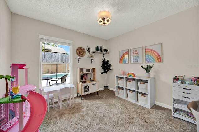1050 Dees Dr, Oviedo, FL 32765 - playroom featuring carpet floors, a textured ceiling, and baseboards