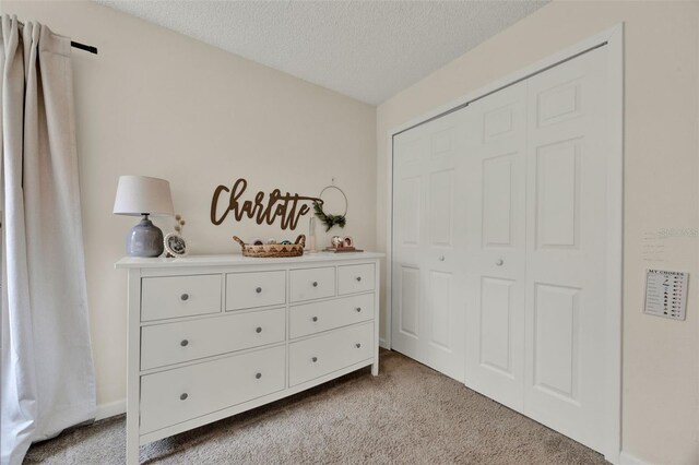 1050 Dees Dr, Oviedo, FL 32765 - carpeted bedroom featuring a textured ceiling