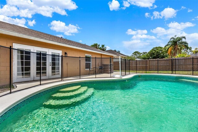 1050 Dees Dr, Oviedo, FL 32765 - view of pool featuring a patio, fence, and french doors