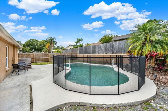 1050 Dees Dr, Oviedo, FL 32765 - view of swimming pool featuring a patio area and a fenced backyard