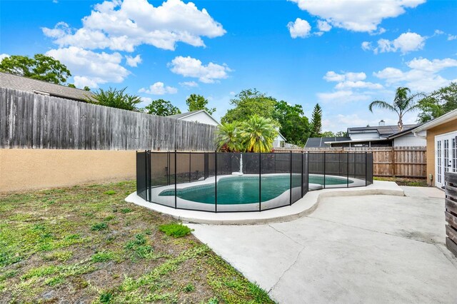 1050 Dees Dr, Oviedo, FL 32765 - view of swimming pool featuring a fenced backyard and a patio