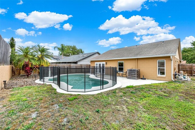 1050 Dees Dr, Oviedo, FL 32765 - rear view of property with concrete block siding, a patio area, and roof with shingles