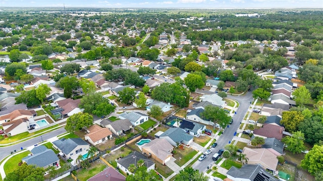 1050 Dees Dr, Oviedo, FL 32765 - aerial view of property and surrounding area with nearby suburban area