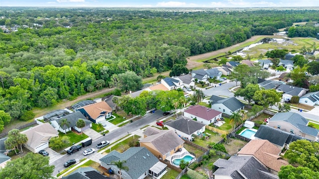 1050 Dees Dr, Oviedo, FL 32765 - aerial view of property and surrounding area featuring a heavily wooded area and nearby suburban area