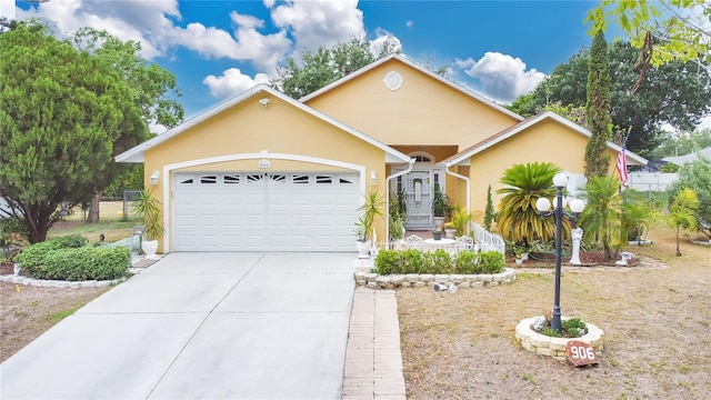 906 Elm Forest Dr, Minneola, FL 34715 - ranch-style home with stucco siding, an attached garage, driveway, and fence