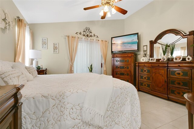 906 Elm Forest Dr, Minneola, FL 34715 - bedroom featuring vaulted ceiling, light tile patterned flooring, and a ceiling fan
