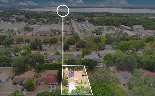 906 Elm Forest Dr, Minneola, FL 34715 - aerial perspective of suburban area featuring a nearby body of water and property parcel outlined