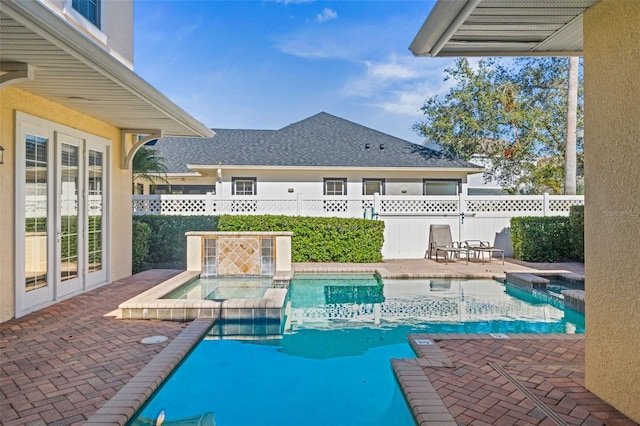 7550 Gathering Dr, Reunion, FL 34747 - view of swimming pool with a pool with connected hot tub and a patio area