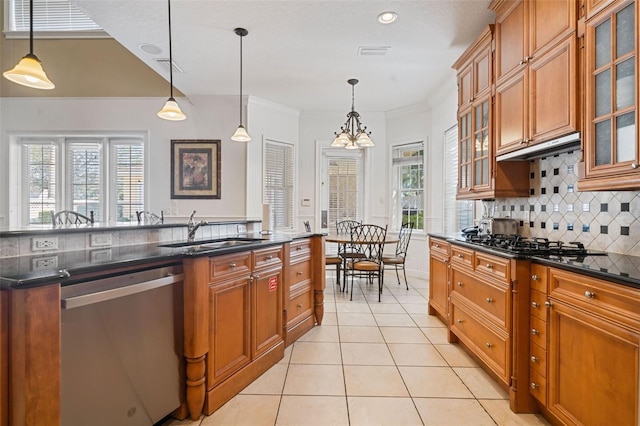 7550 Gathering Dr, Reunion, FL 34747 - kitchen featuring stainless steel dishwasher, a sink, backsplash, brown cabinets, and light tile patterned flooring