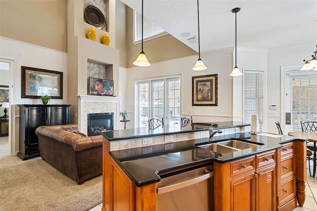 7550 Gathering Dr, Reunion, FL 34747 - kitchen featuring stainless steel dishwasher, a sink, brown cabinets, healthy amount of natural light, and crown molding