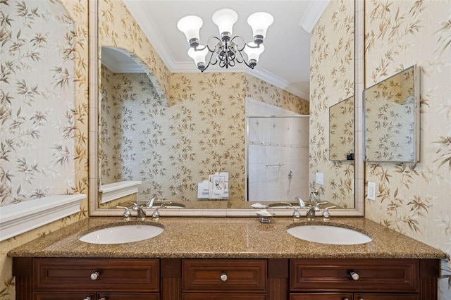 7550 Gathering Dr, Reunion, FL 34747 - bathroom with double vanity, ornamental molding, a chandelier, wallpapered walls, and a tile shower