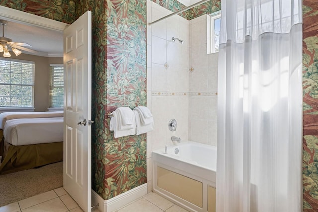 7550 Gathering Dr, Reunion, FL 34747 - ensuite bathroom with tile patterned flooring, shower / bath combination, baseboards, wallpapered walls, and a ceiling fan