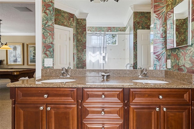 7550 Gathering Dr, Reunion, FL 34747 - bathroom featuring wallpapered walls, double vanity, healthy amount of natural light, ornamental molding, and a shower stall
