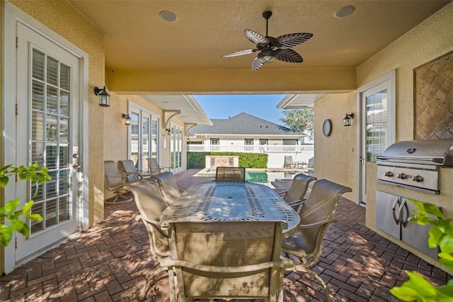 7550 Gathering Dr, Reunion, FL 34747 - view of patio / terrace featuring outdoor dining space, ceiling fan, and french doors