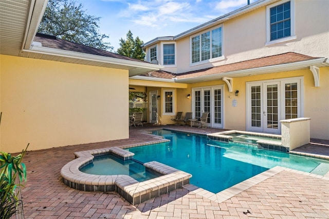 7550 Gathering Dr, Reunion, FL 34747 - view of swimming pool with french doors, a pool with connected hot tub, and a patio area