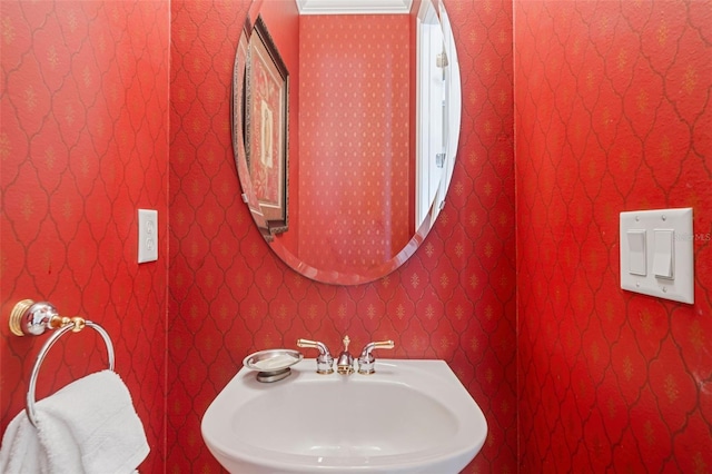 7550 Gathering Dr, Reunion, FL 34747 - bathroom with a sink and wallpapered walls